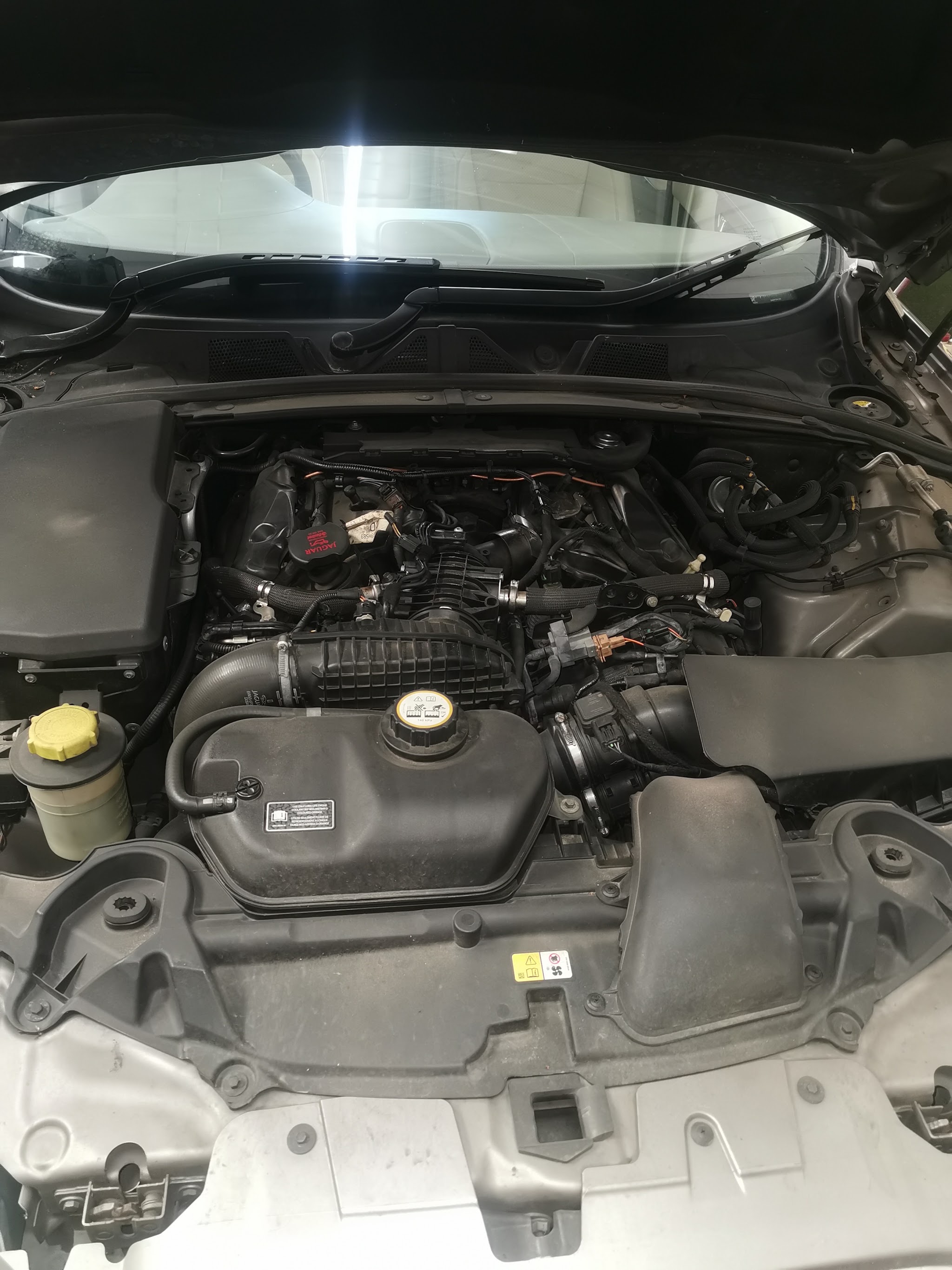 A supercharged Jaguar V8 under the bonnet at LP Autotech